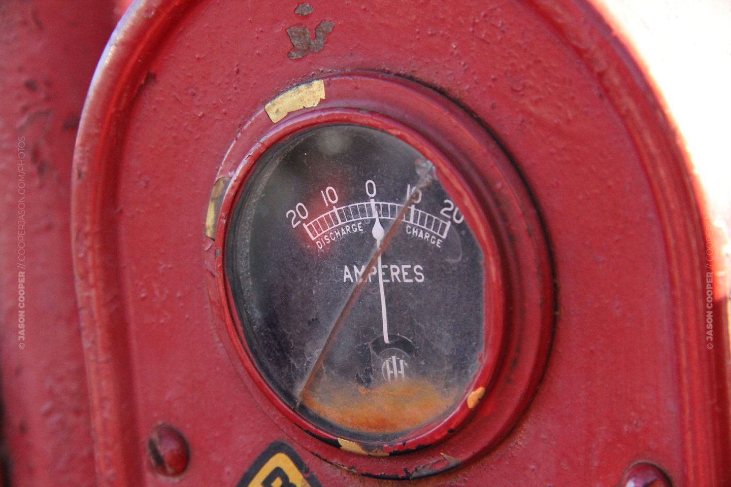 photo of a gauge on an old red McCormick Farmall Tractor