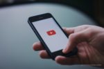 photo of youtube app on a phone - post graphic for Can I downlaod a Youtube video for offline use?